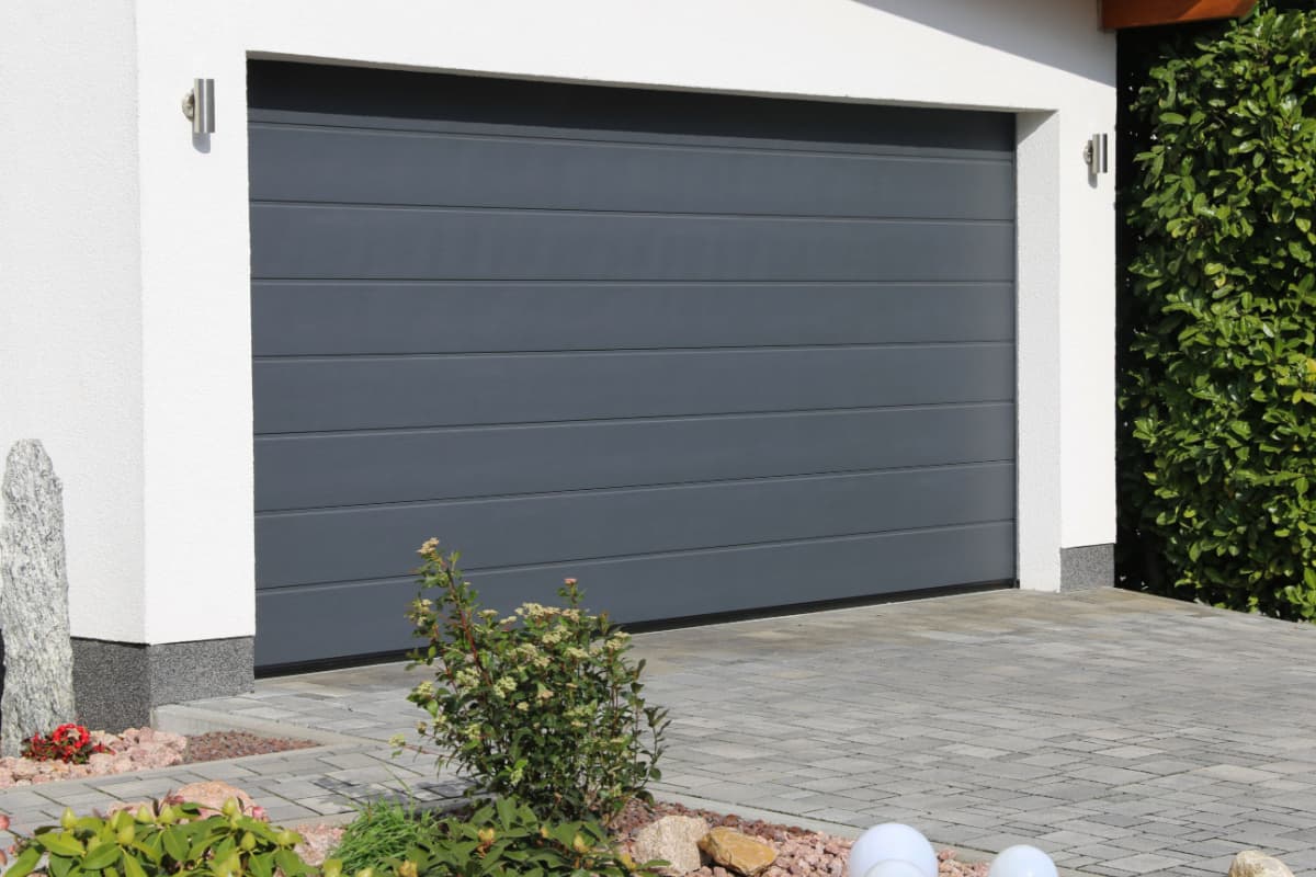 New carriage-style garage door installed on a home