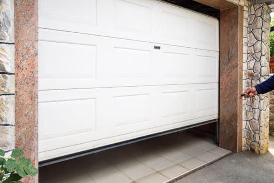 Garage door stuck partially open on a home